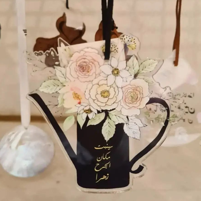 صورة   تعليقة سيارة  سينبت مكان الجرح زهرا